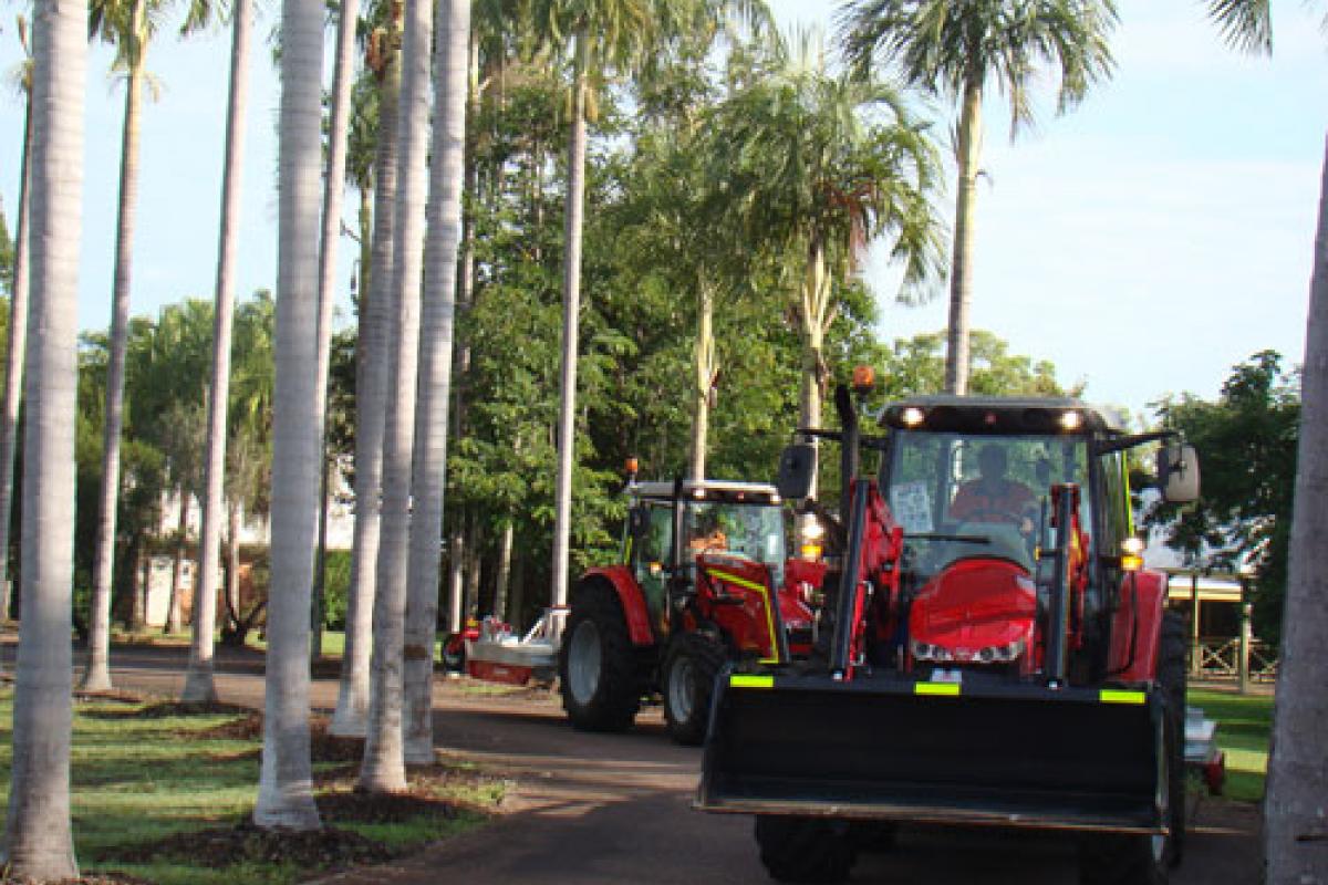 Tractors driving along footpath