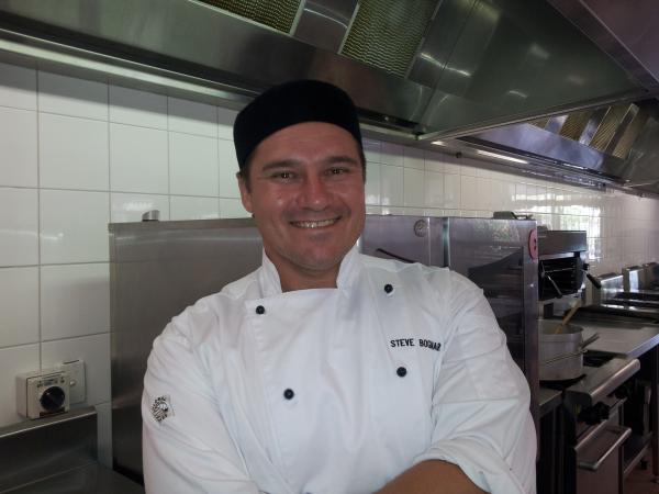A chef smiling